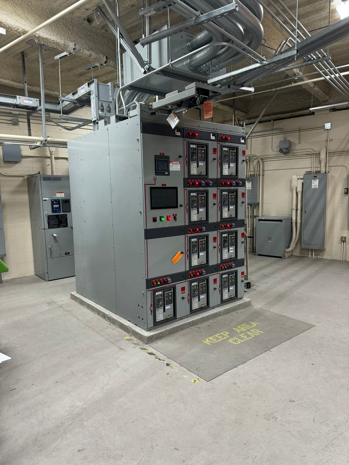 Low-voltage switchgear lineup with metered circuit breakers in a facility electrical room
