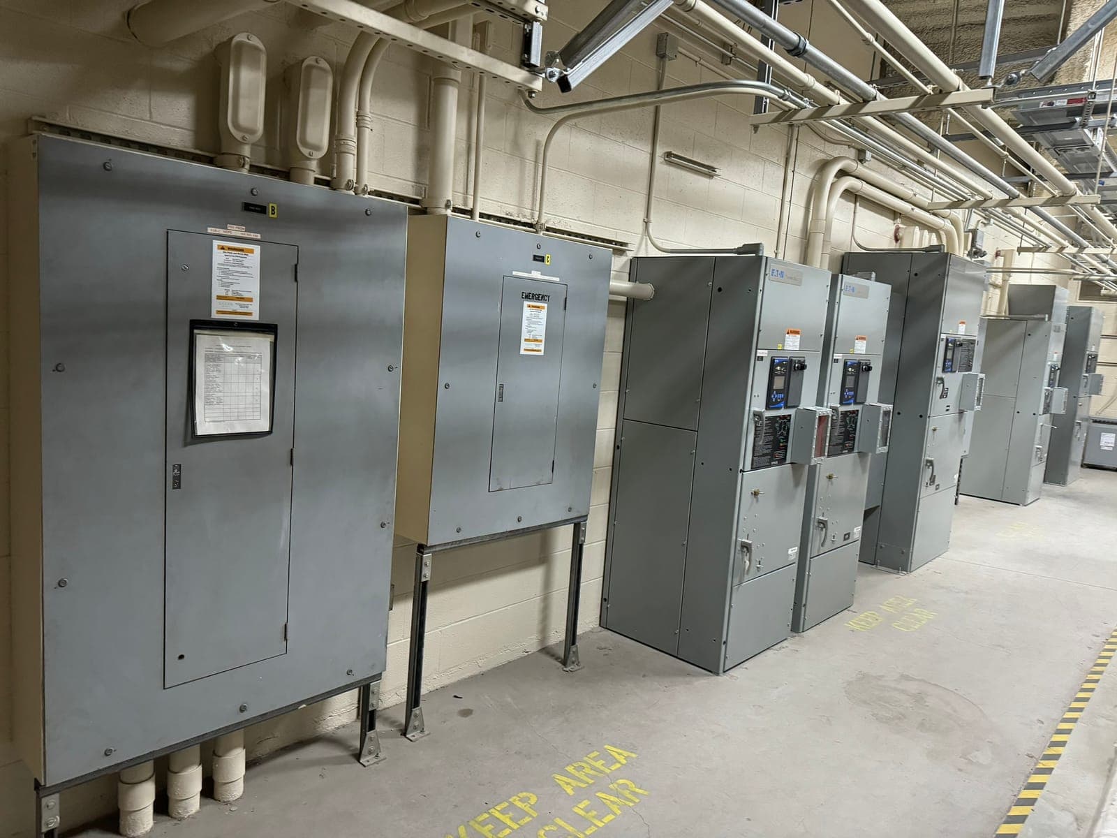 Distribution panelboards and feeders in a facility electrical room